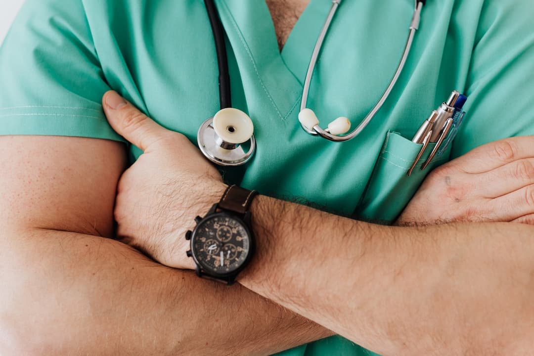 Male doctor with his arms crossed stock image